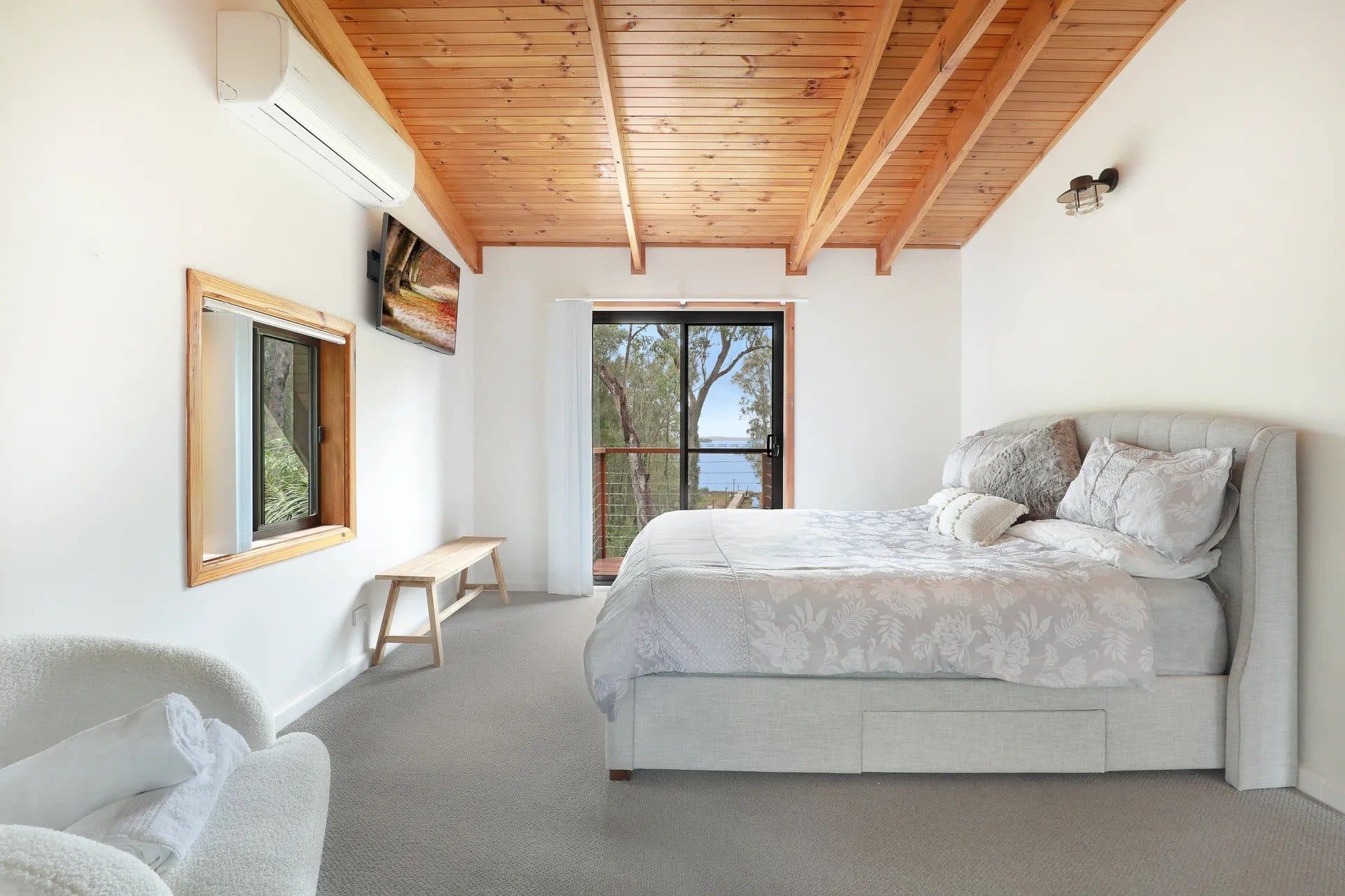 Main bedroom at The Treehouse, Serenity 222, among the gum trees