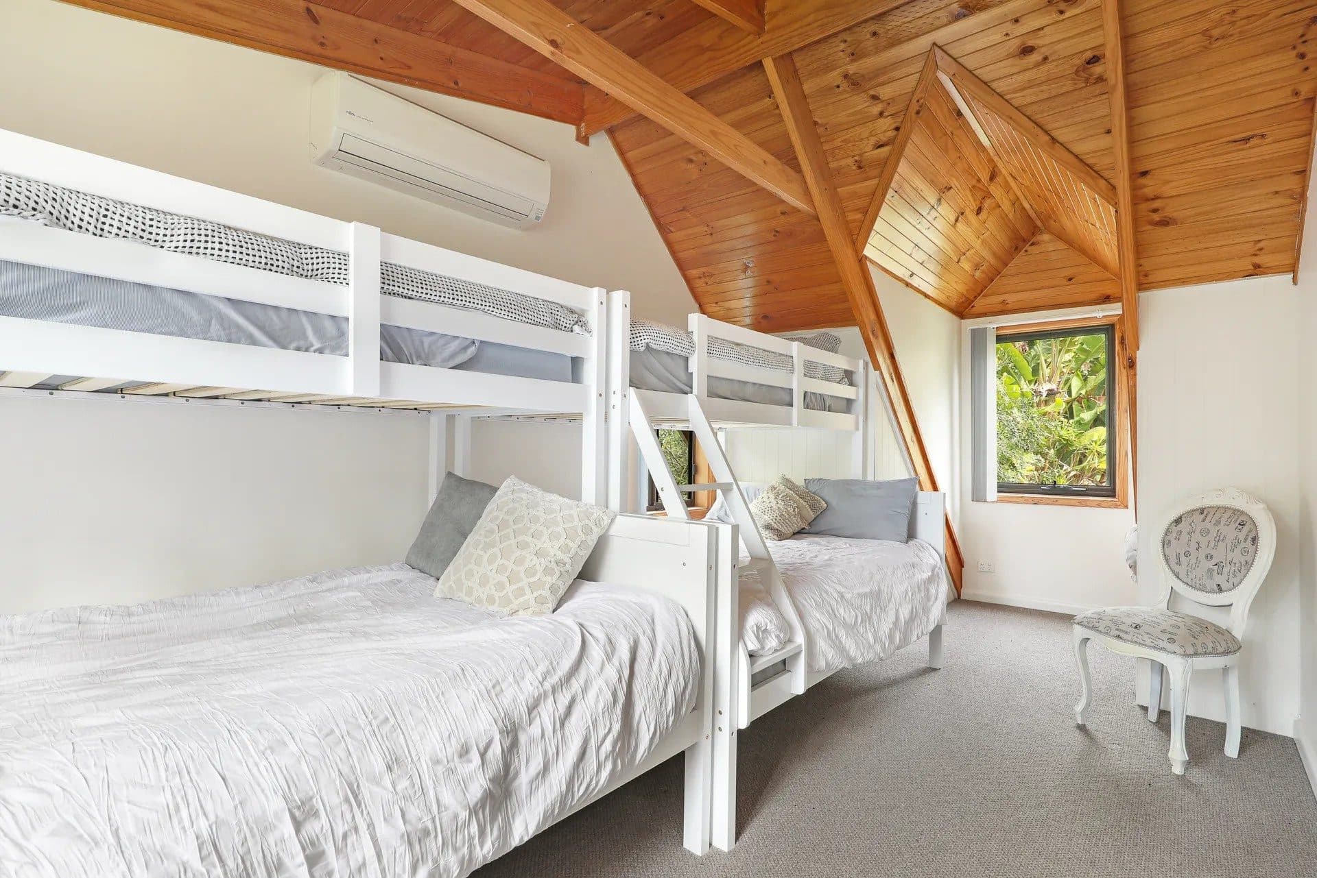 Bunk room at The Treehouse, Serenity 222 — five beds across three bedrooms