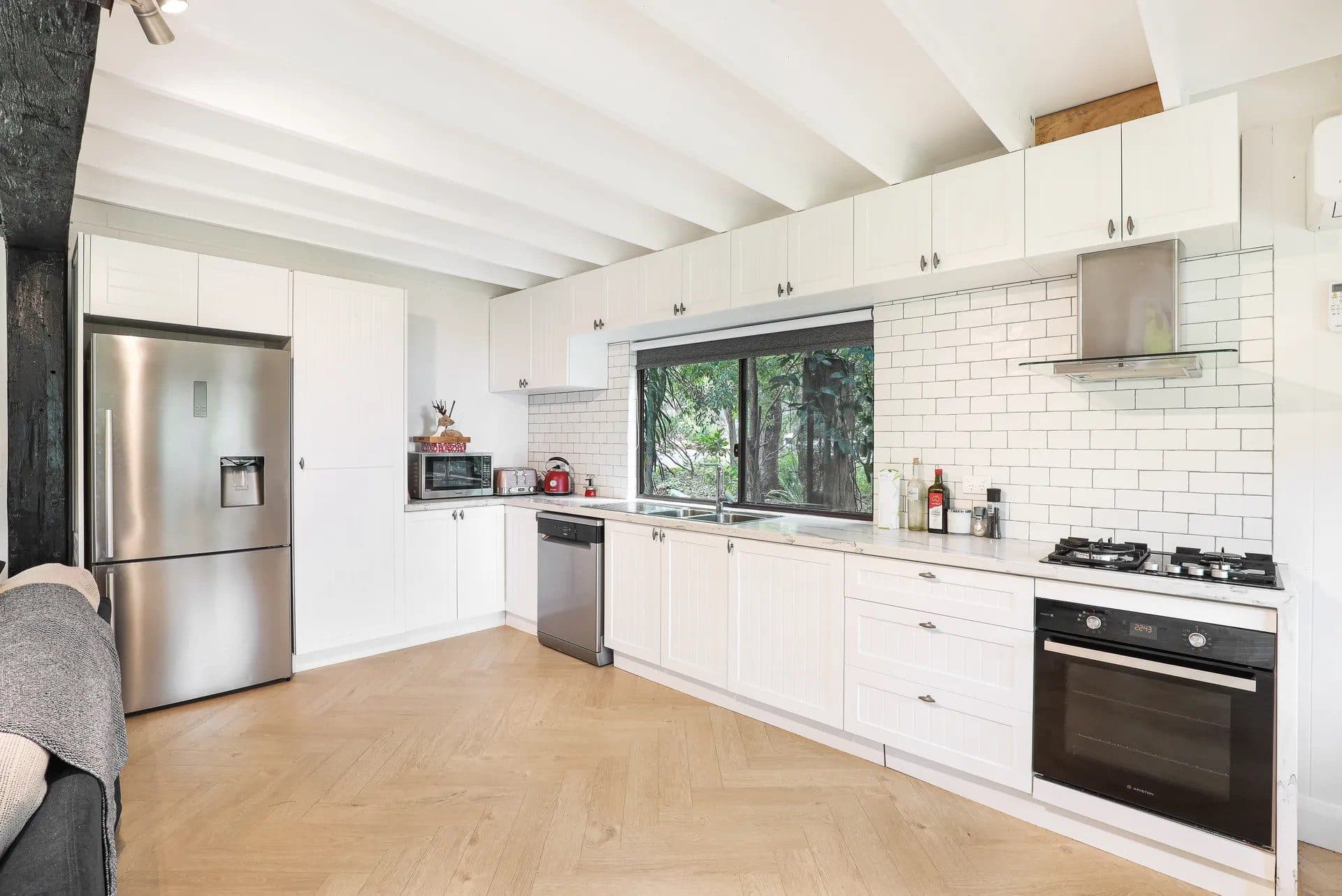 Full kitchen at The Treehouse, Serenity 222, ready for family dinners