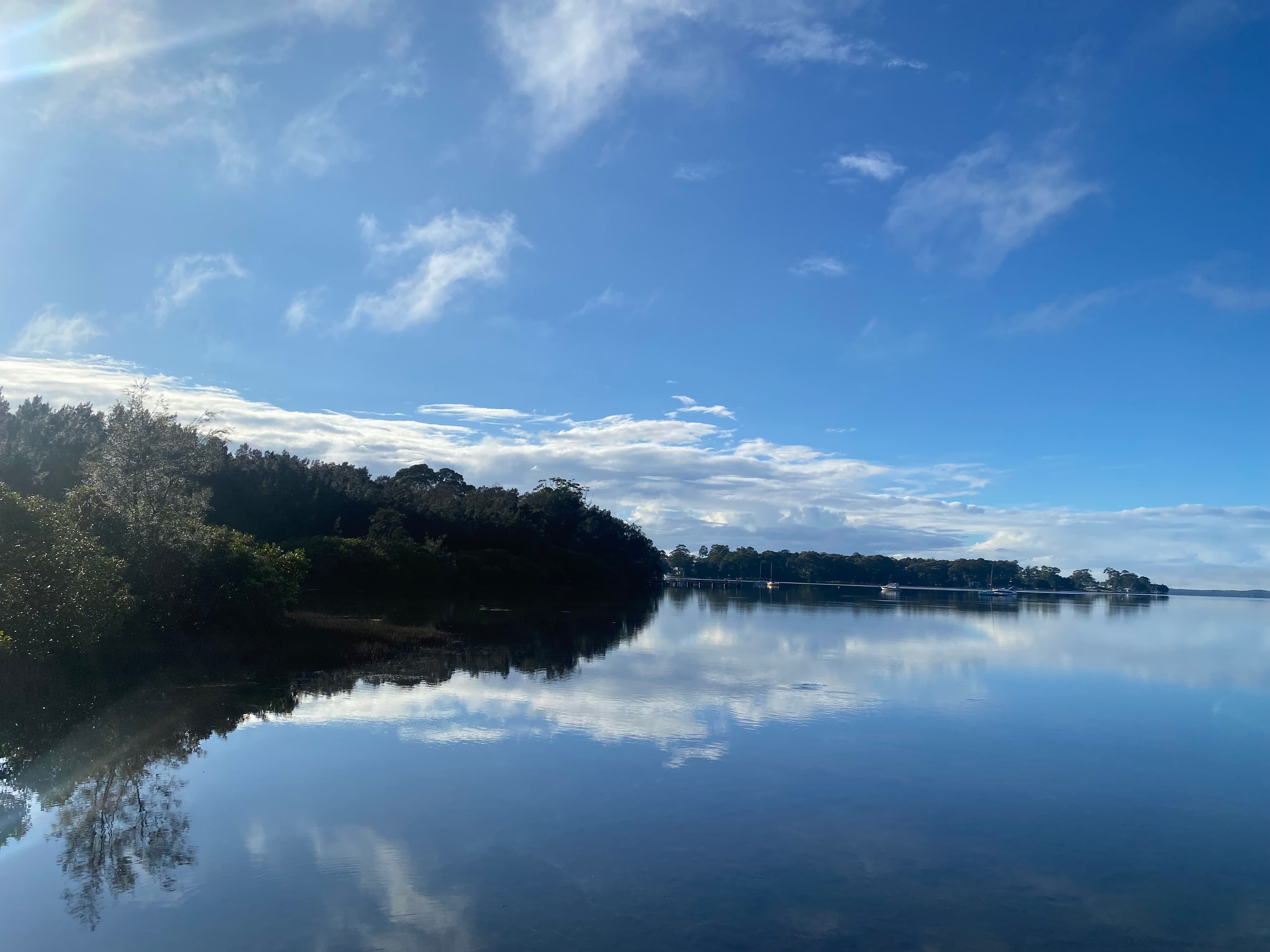 Still water reflections on St Georges Basin at Serenity 222