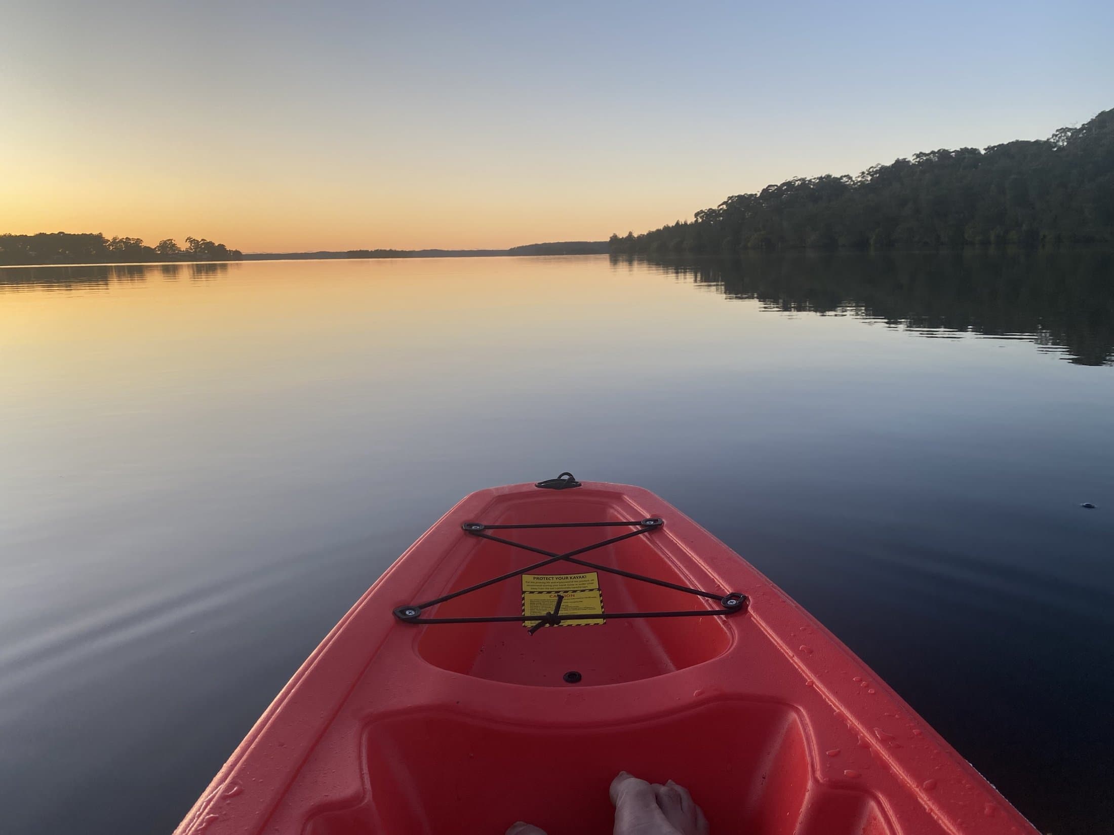 Setting off by kayak on the still water of St Georges Basin at Serenity 222
